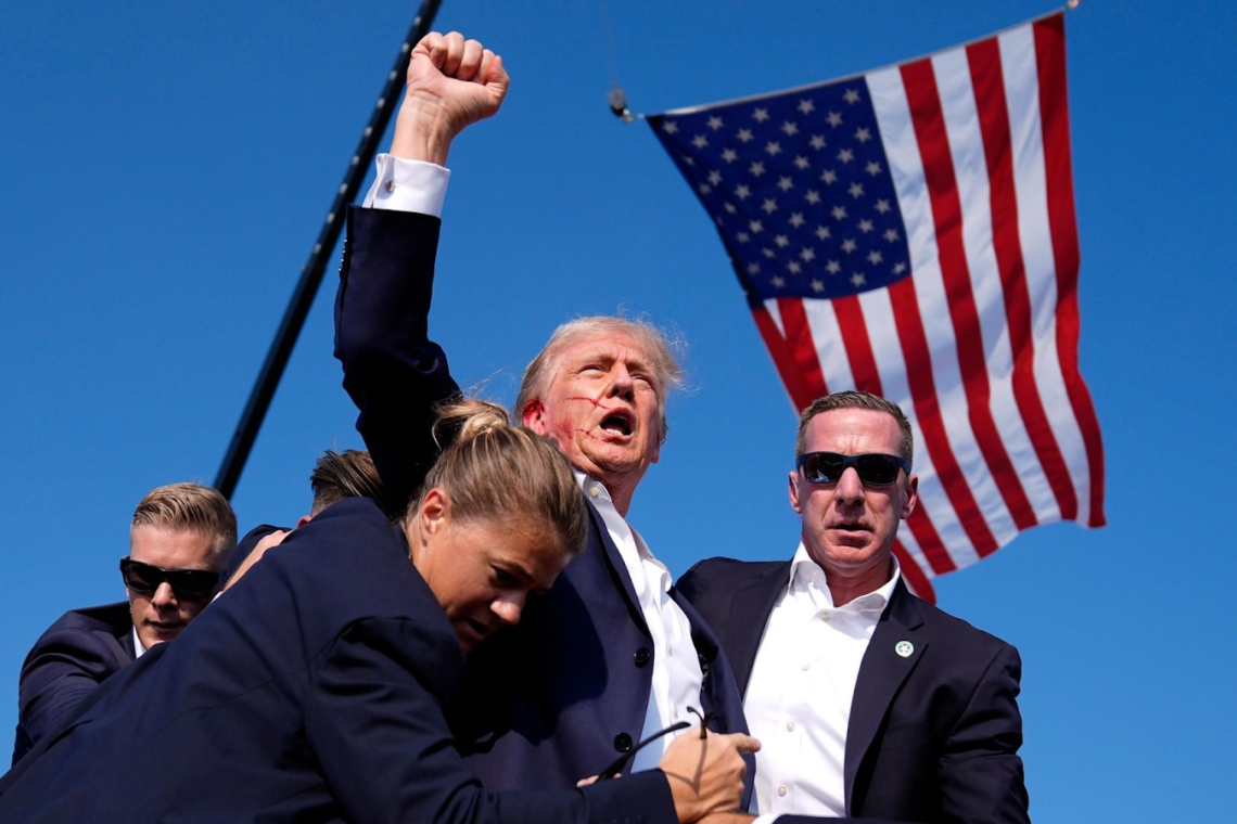 Donald Trump raising his fist after an assassination attempt on him